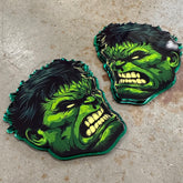 Set of custom Hulk car badges showcasing an aggressive hulk face design, perfect for vehicle customization and Marvel fans.
